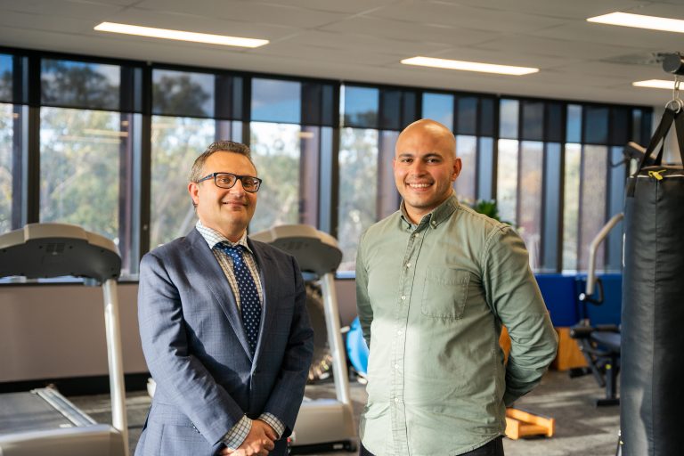 Interior view of a modern physiotherapy clinic treatment area at Active Recovery in Canberra, showing therapy tables, exercise equipment, and bright natural-light spaces where patients receive rehabilitation and movement care.